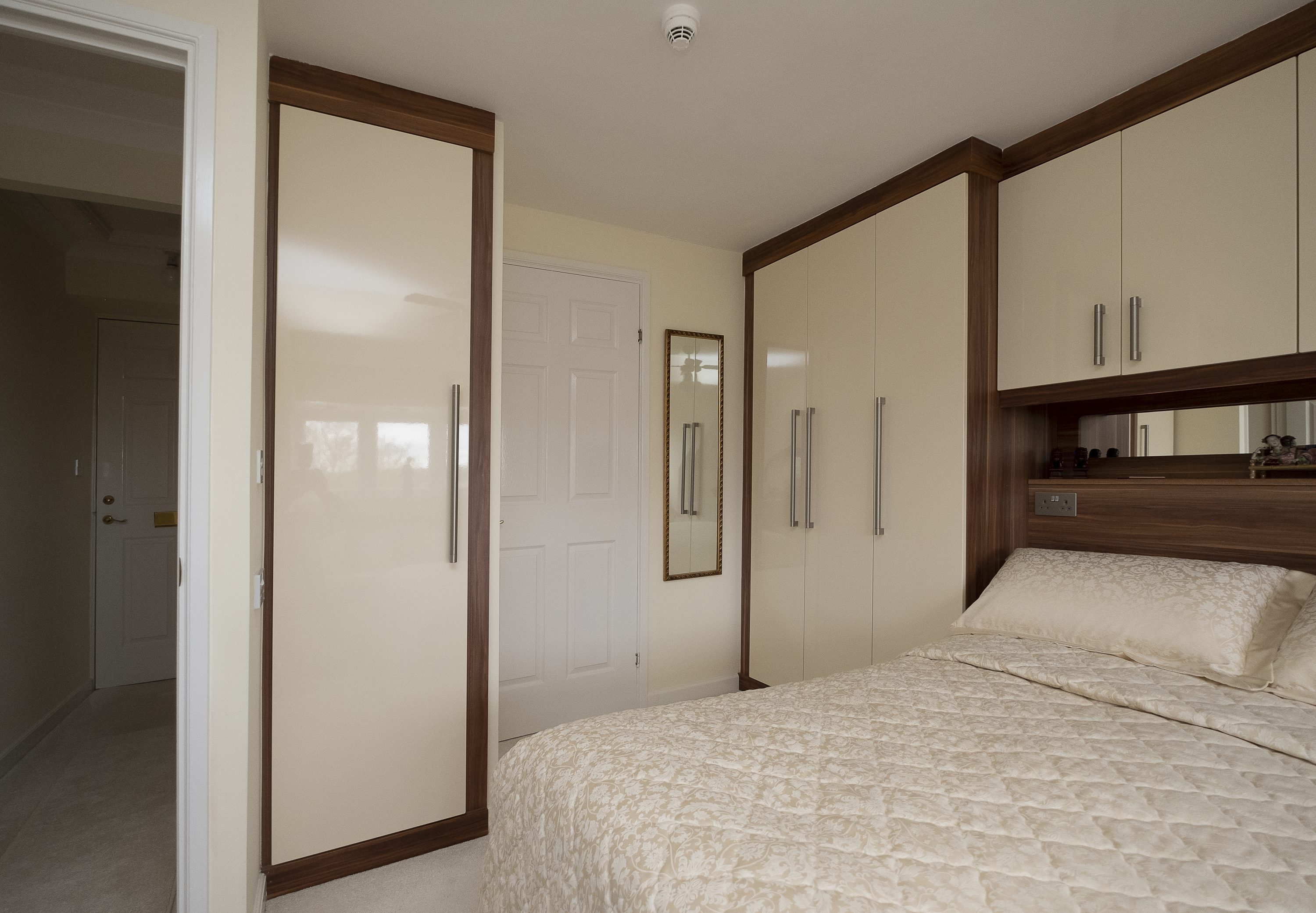 Pencil Round Design – Gloss Cream Doors with Opera Walnut Surround